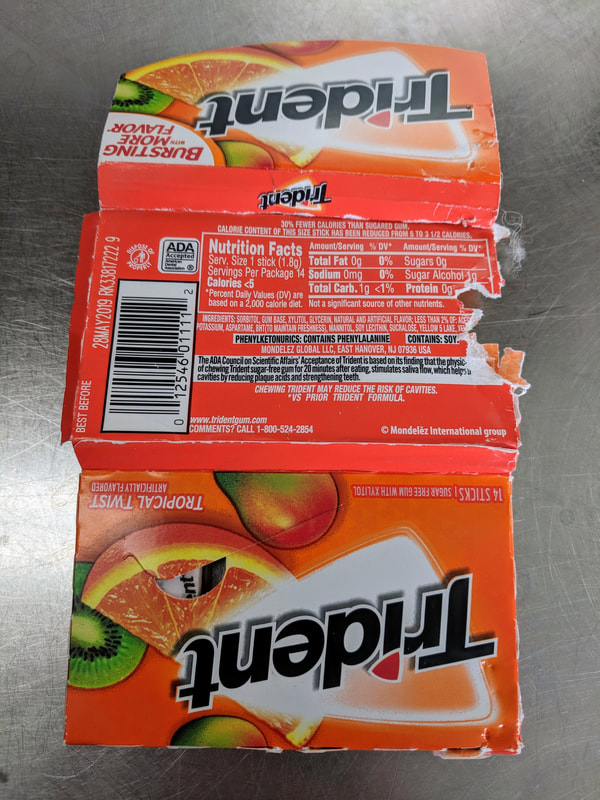 Chewed Trident gum pack